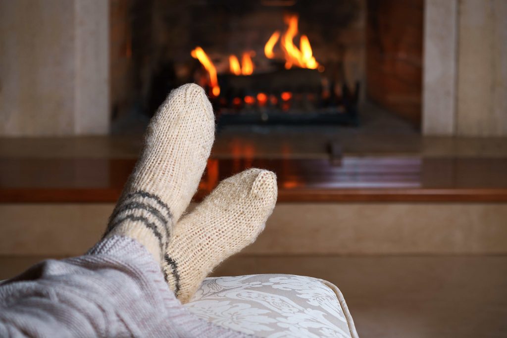 Feet warming by a fire